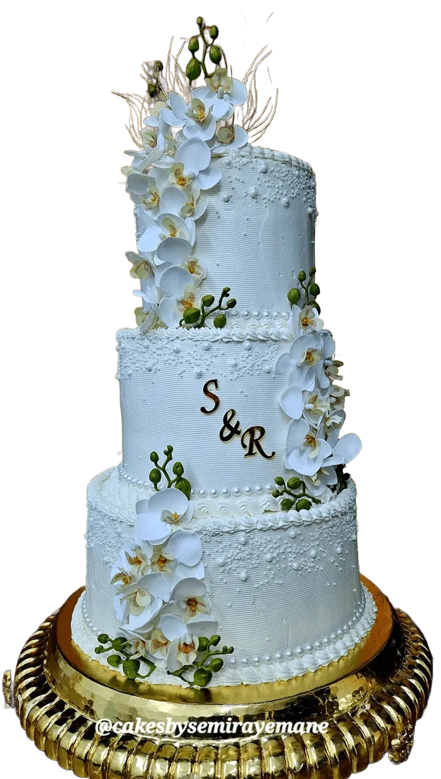 Pale blue and gold tiered wedding cake with initials