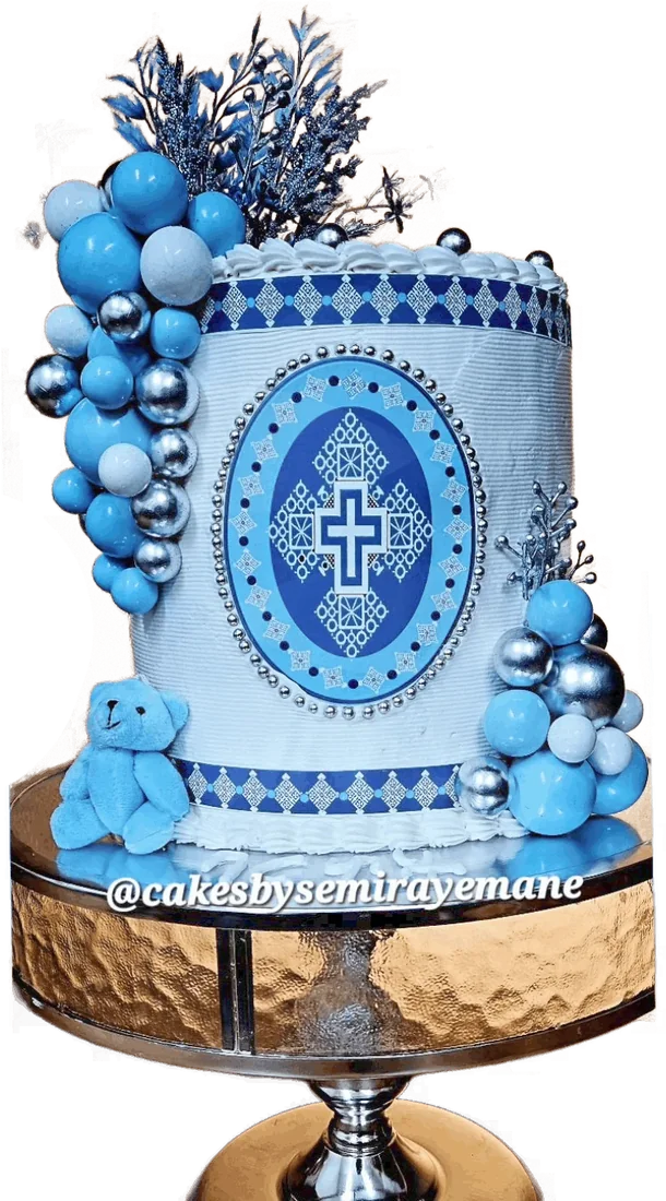 Blue patterned birthday cake with blue and silver balloon spheres