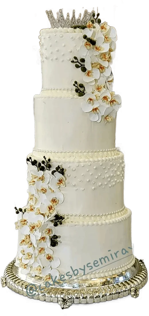 Four-level white wedding cake with cascading white orchids on a silver stand